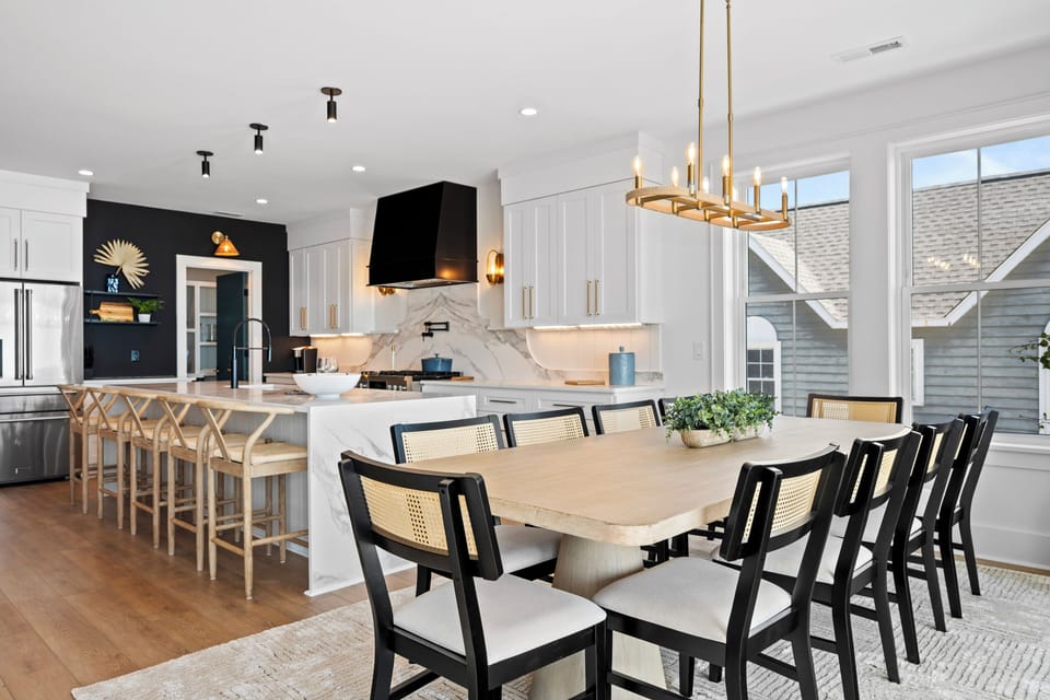 Your spacious open-concept kitchen flows seamlessly into the dining area, where marble countertops and designer lighting create the perfect space for memorable meals together.