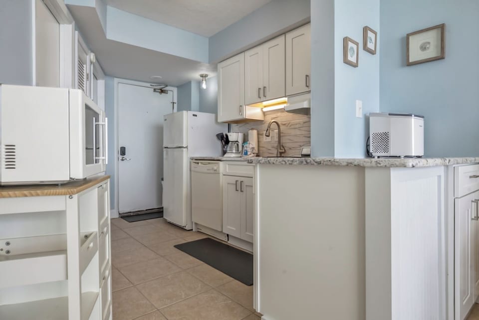 Modern Kitchen Perfect for Cooking Meals - Including Coffee Pot, Stove, Dishwasher, and More!