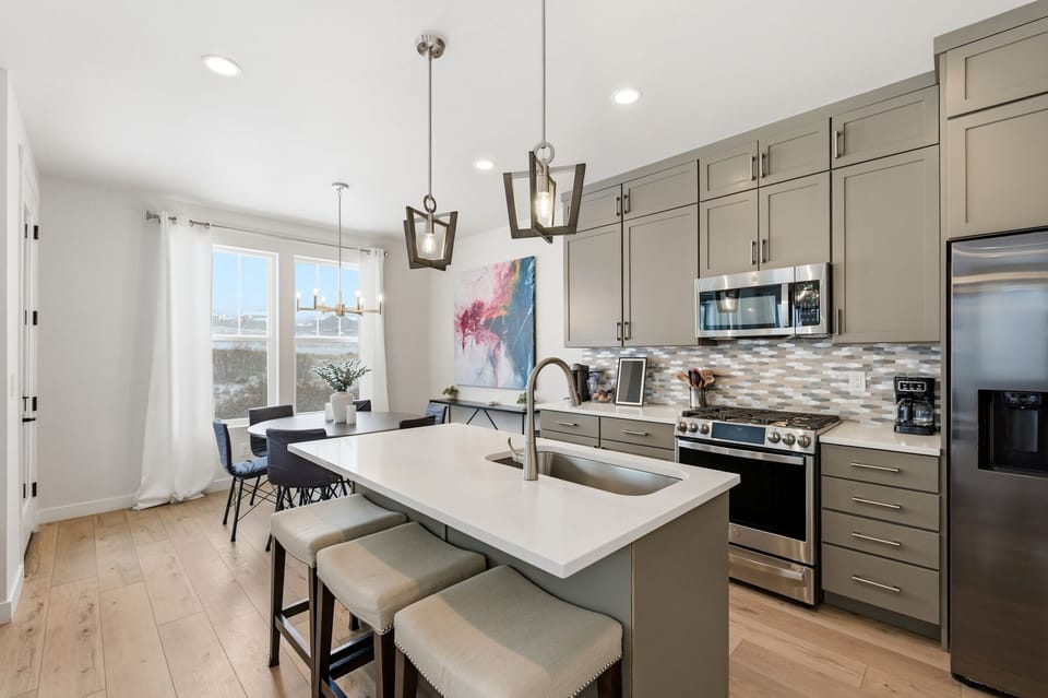 Fully equipped kitchen where guests can cook meals and gather around the island.