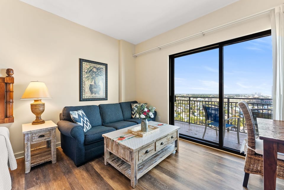 Unwind in your bright living space with comfortable seating and city views from your private balcony.