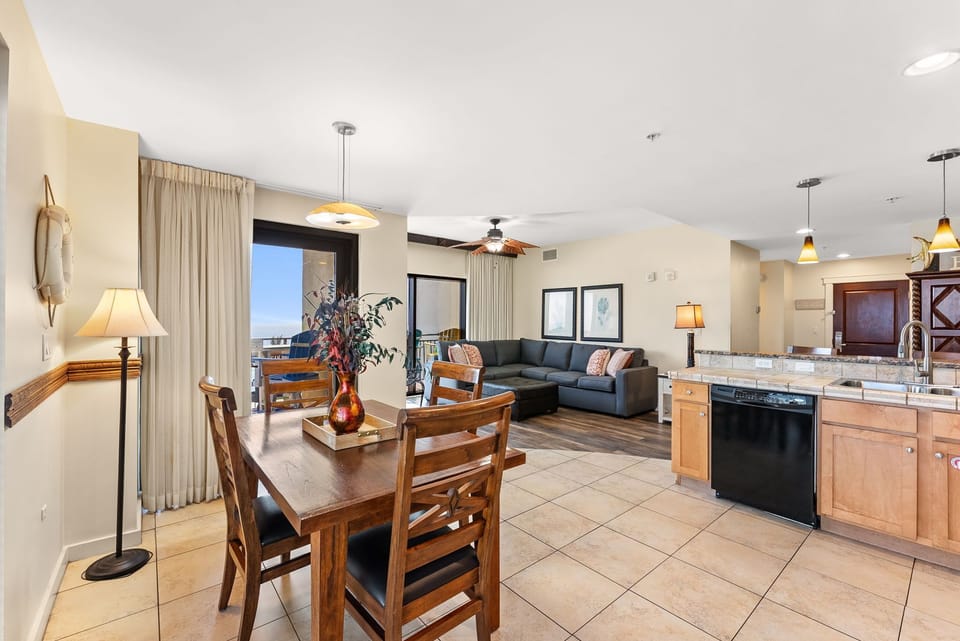 Relax in your spacious open-concept suite with modern kitchen, comfortable dining area, and inviting living room—perfect for unwinding after exploring.