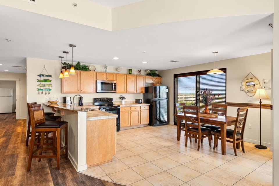 Your spacious kitchen and dining area features granite counters, stainless appliances, and warm wood touches for memorable meal prep.