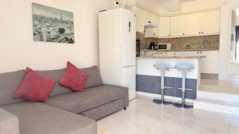 Apartment, Bay View | Living area | 50-inch flat-screen TV with digital channels