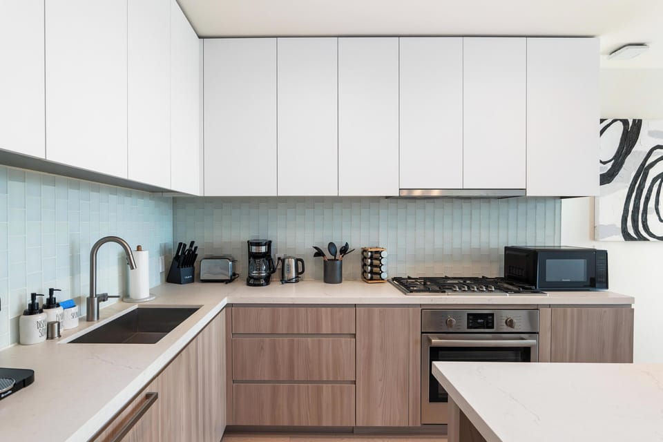Coastal Chef’s Kitchen—Sleek Scandinavian design meets premium appliances.