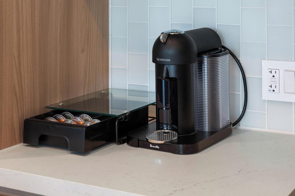Café-ready: A bright, polished nook with premium espresso for every guest.