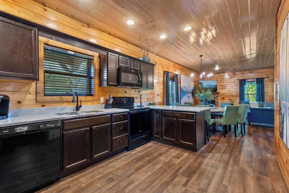 Cozy cabin kitchen with open concept so you do not miss any of the memories. 