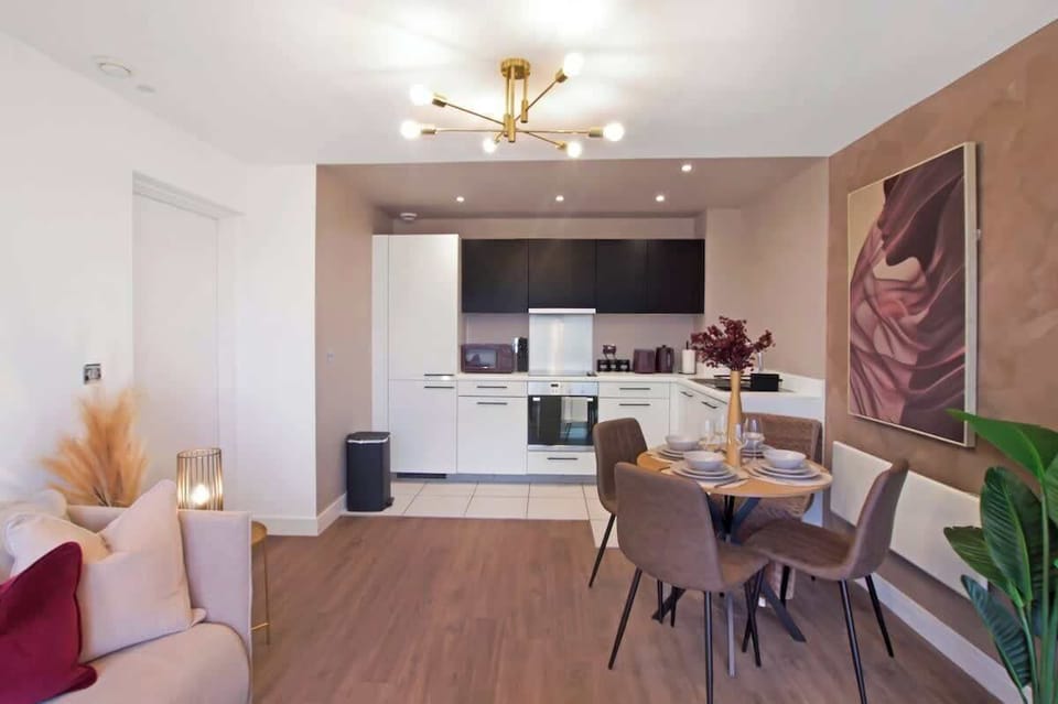 Comfortable dining area set for four, perfect for relaxed meals during your stay.
