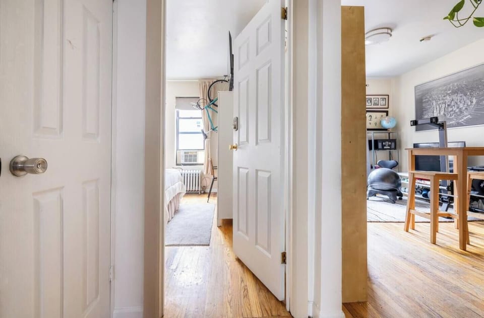 Looking from entryway to Your Room (left), Livingroom/Kitchen (right)