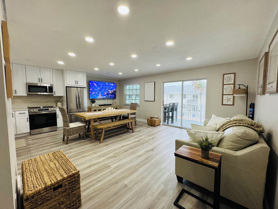Deluxe Condo, Balcony, Ocean View | Living area | 75-inch Smart TV with cable channels, offices