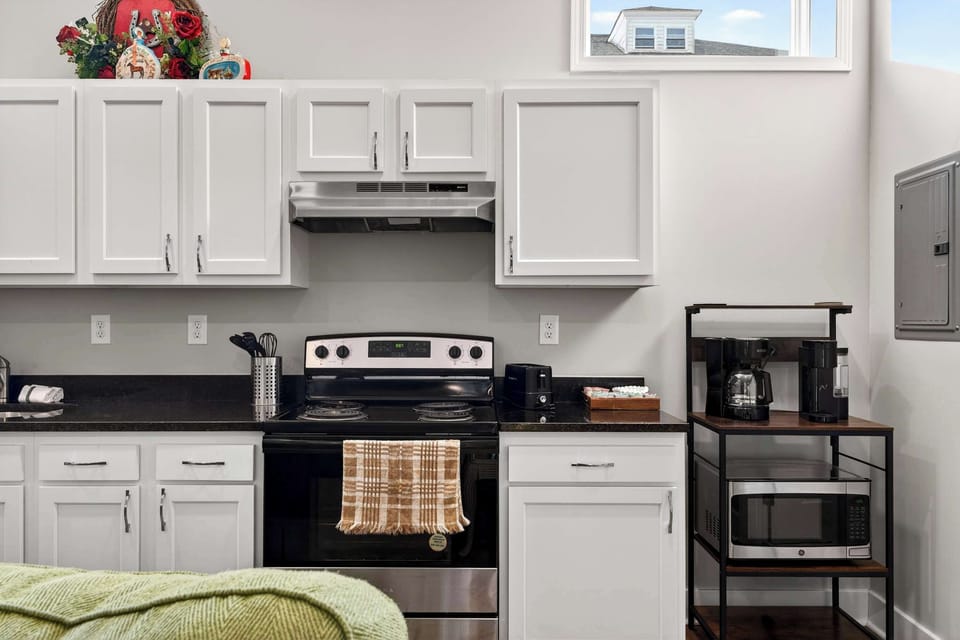Kitchen: Compact kitchen with smart design and all essentials for easy, convenient cooking.
