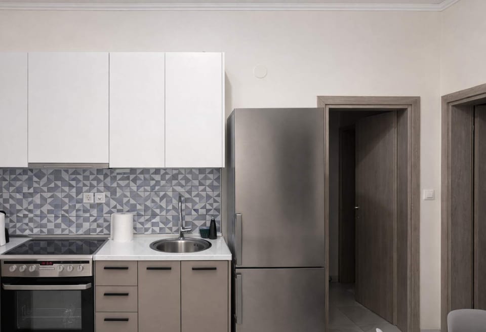Fully equipped kitchen with modern appliances, spacious counters, and everything needed for cooking at home.