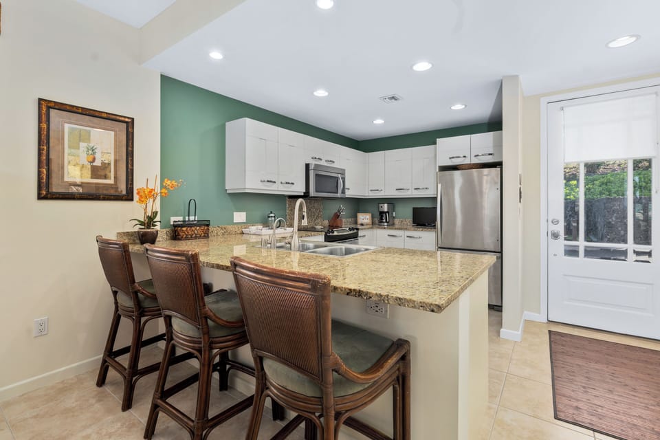 The kitchen has all the necessary appliances and amenities.
