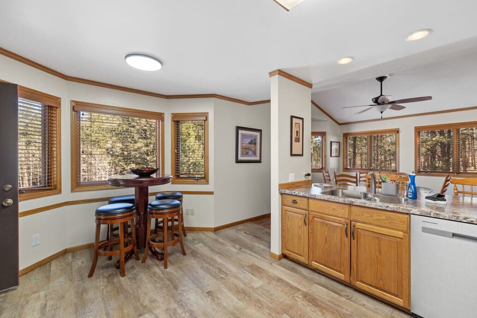 Large windows let in plenty of natural light and fresh morning air, creating a cheerful and airy atmosphere to start your day.