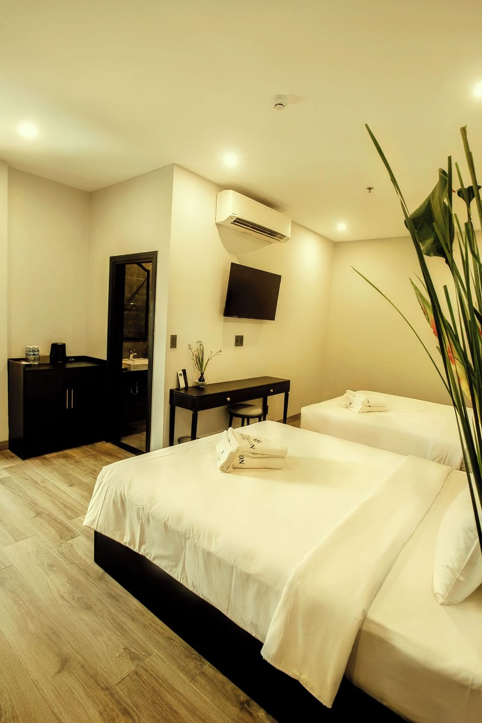 Family Suite, City View | Premium bedding, minibar, in-room safe, laptop workspace