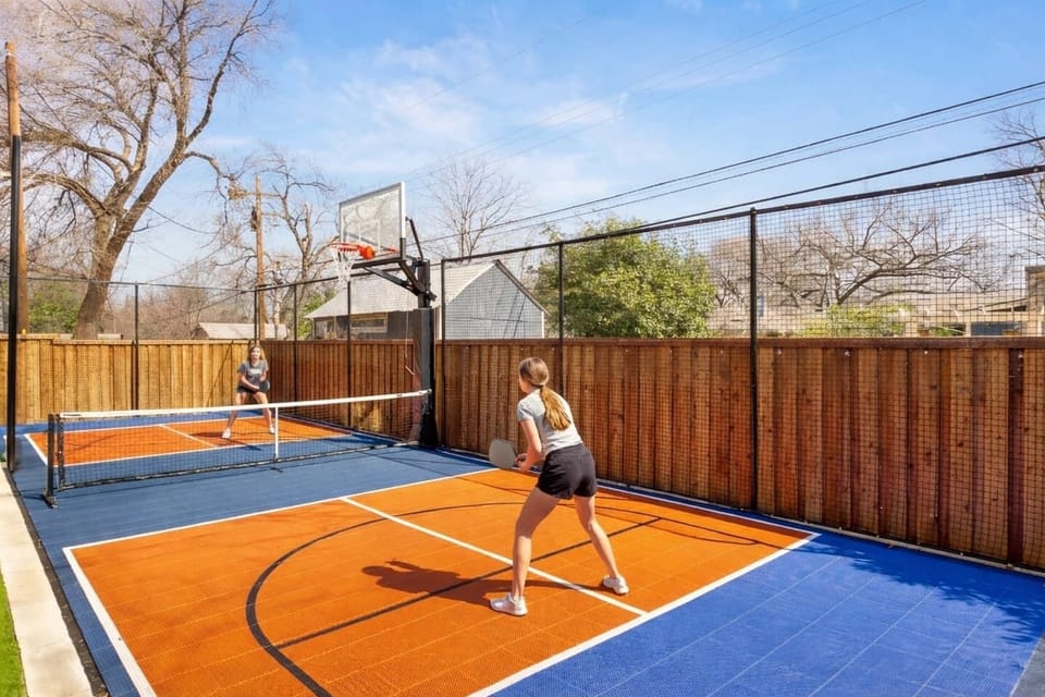 Private backyard sport court — rally under the Austin sun, shoot hoops, and turn your stay in the heart of Austin into a high-energy getaway. This is where friendly competition meets luxury Austin Airbnb living.