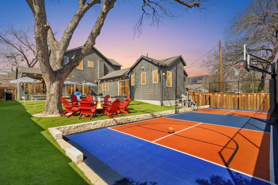 Private sport court and fire pit lounge at Groove & Glam Retreat.