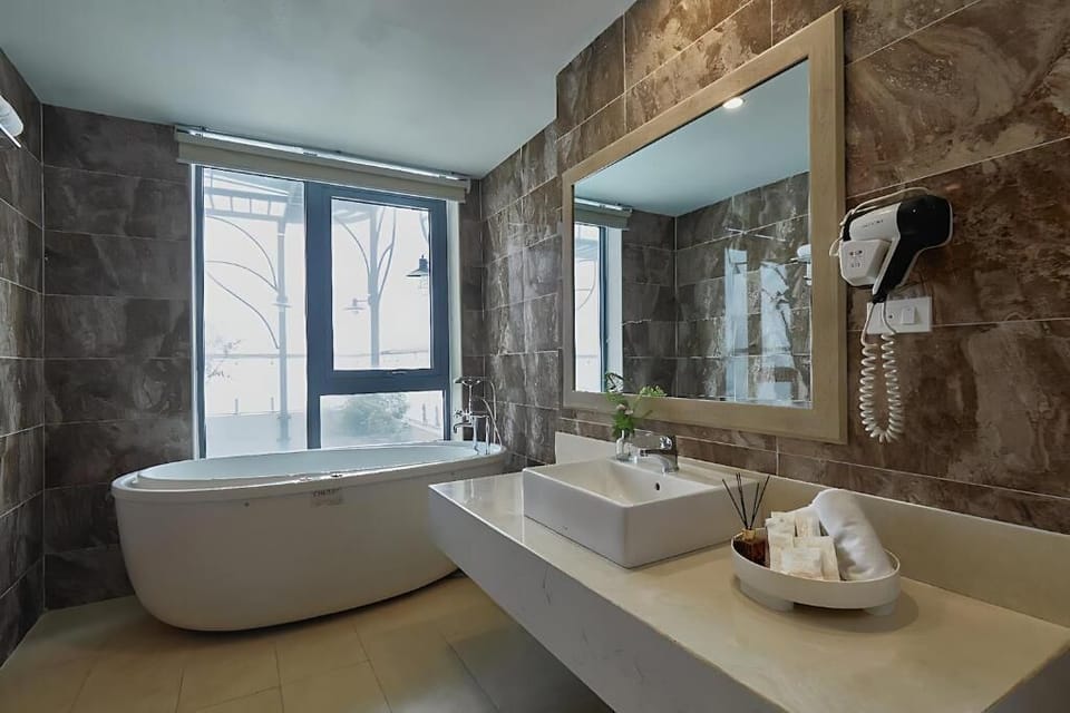 Luxury Suite, City View | Bathroom | Separate tub and shower, free toiletries, slippers, soap