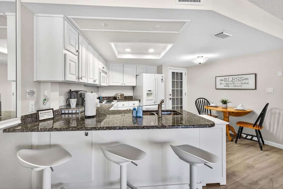 The heart of the home — gather, dine, or sip wine around the island.