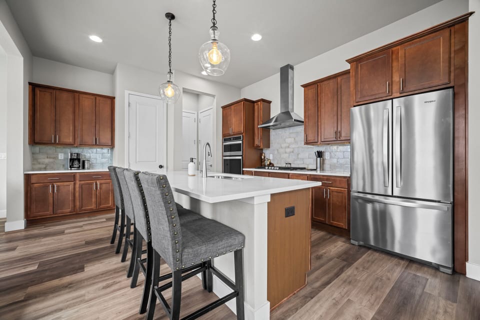 Open kitchen bar perfect for casual chats and quick bites.
