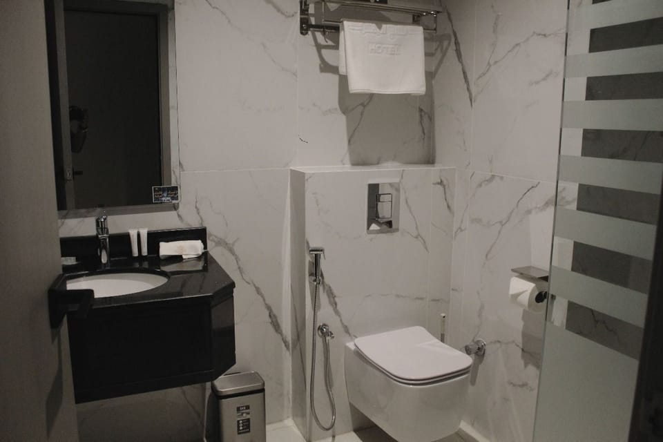 Separate tub and shower, hair dryer, slippers, bidet
