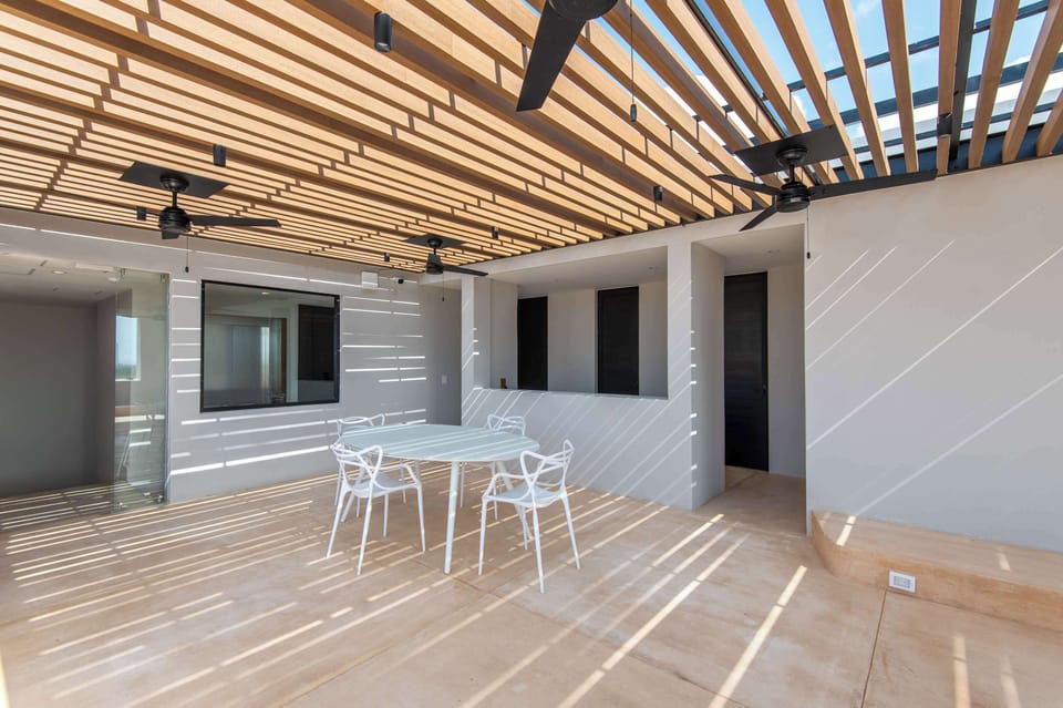 Covered Rooftop Terrace with Outdoor Dining