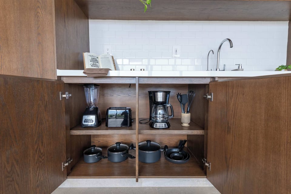 Equipped with blender, coffee maker, toaster, and cookware