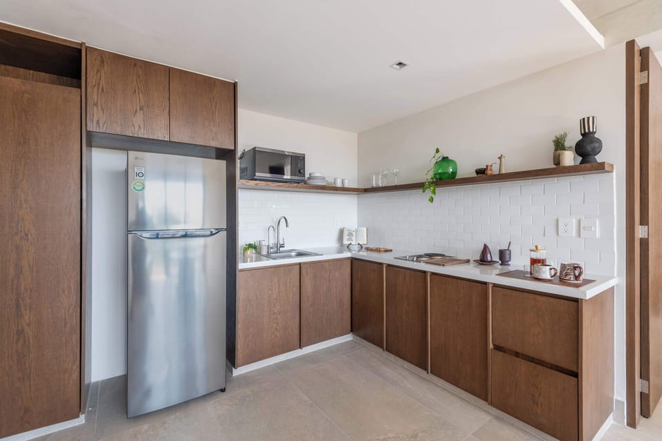 Full kitchen with fridge, microwave, and stove