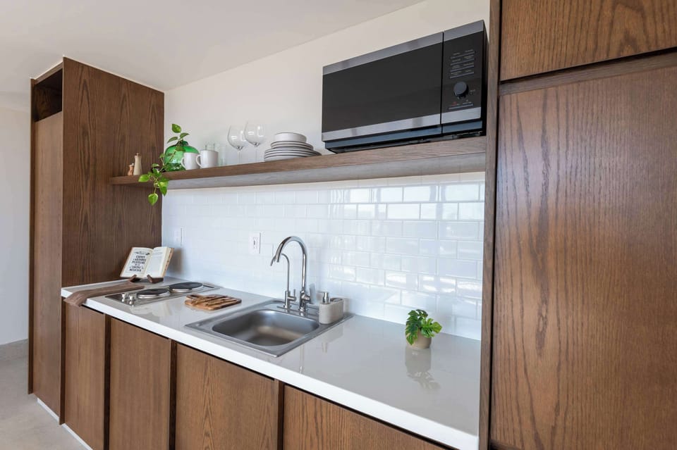 Full kitchen with fridge, microwave and stove
