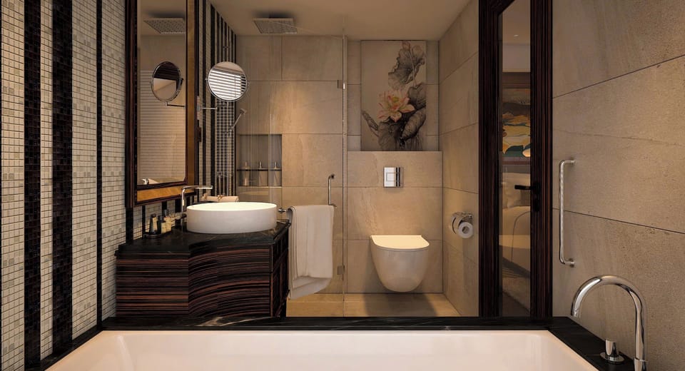 Separate tub and shower, hydromassage showerhead, designer toiletries