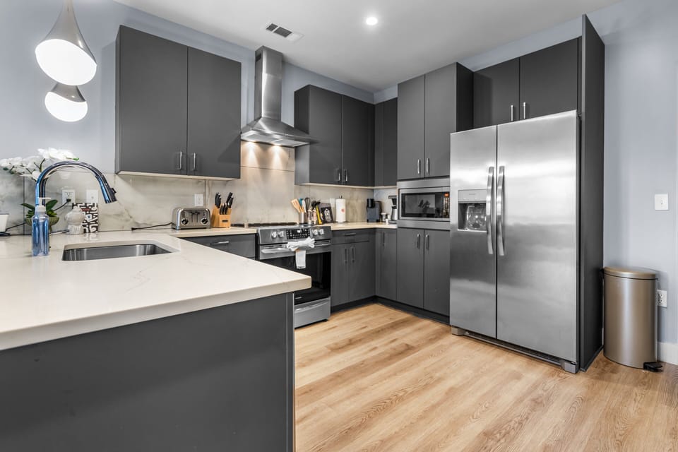 Full kitchen with stainless appliances and all the cooking essentials for your stay + coffee
