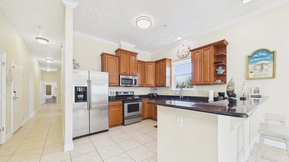 Fully applianced kitchen with ample counter space and all the cooking essentials for your stay