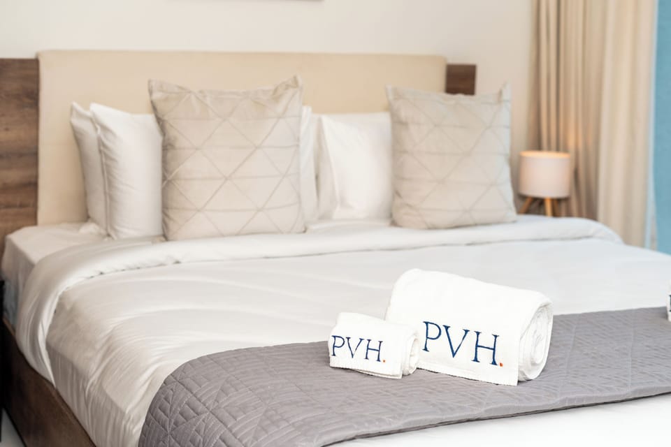 Exclusive Apartment, 1 King Bed, Balcony, Pool View | In-room safe, blackout drapes, soundproofing, iron/ironing board