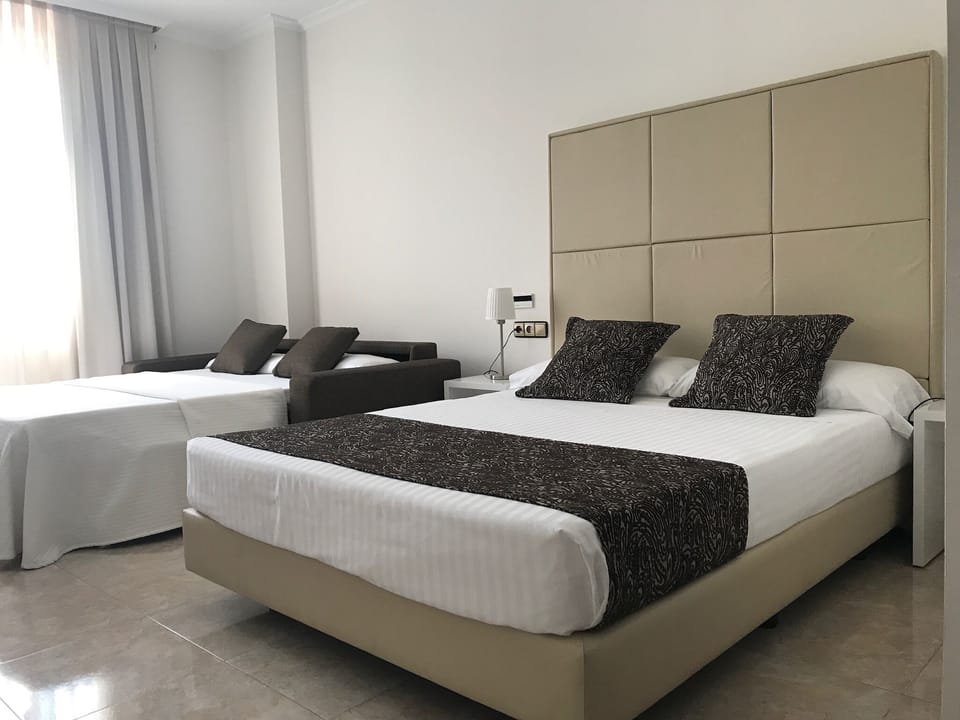 Family Room (2 Adults and 2 children) | Minibar, desk, laptop workspace, blackout drapes