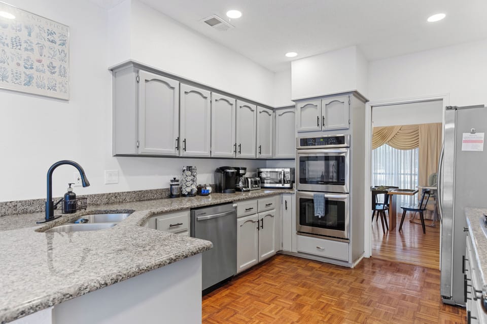 Complete kitchen with all essential cookware and appliances.