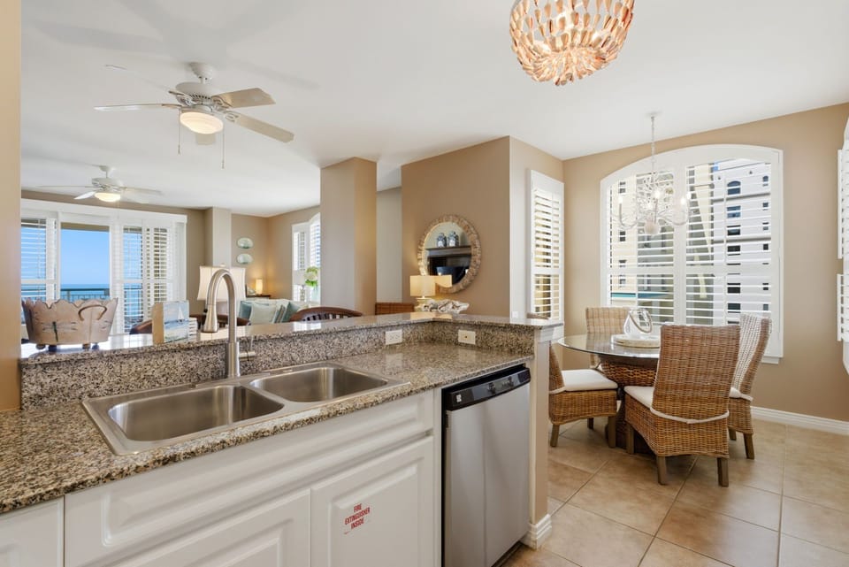 Beach Colony T PH1D- Step into your bright, open-plan coastal retreat where the kitchen, dining, and living areas flow seamlessly together. Granite countertops, stainless appliances.