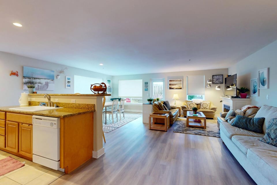 Open living space connecting the kitchen and seating area.