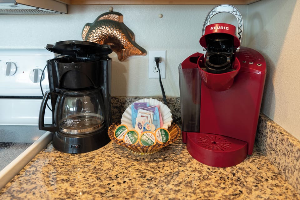 Coffee station with both a drip coffee maker and single-serve option, perfect for your morning routine.