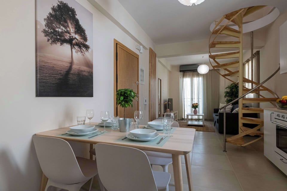 Dining Space with Table, Chairs, and Decorative Art