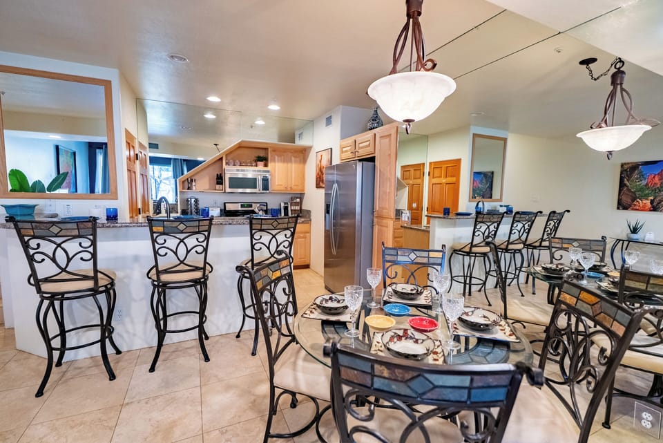 Gather around your elegant glass dining table and cook together in the fully equipped kitchen with modern appliances and granite countertops.