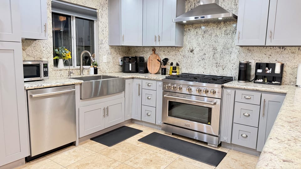 Gourmet kitchen with modern appliances, fully stocked for meals prep,cooking fun