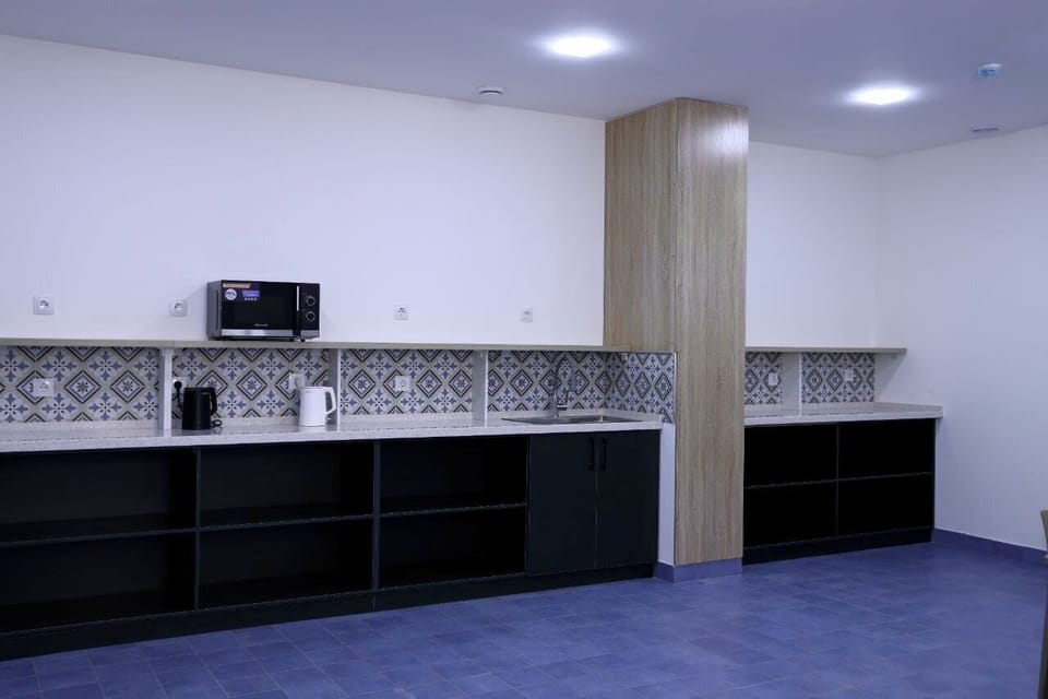 Full-size fridge, microwave, stovetop, rice cooker