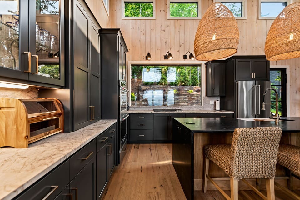 Cook in the chef’s kitchen w/  quartz counters, island seating, & double ovens.