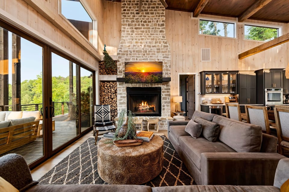 Relax in the grand living area with soaring ceilings and stone fireplace.