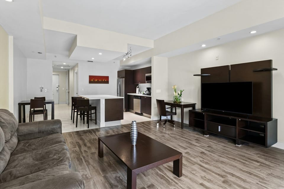 Bright open living space with modern furnishings and clean lines, designed for relaxing together after a day in Miami.