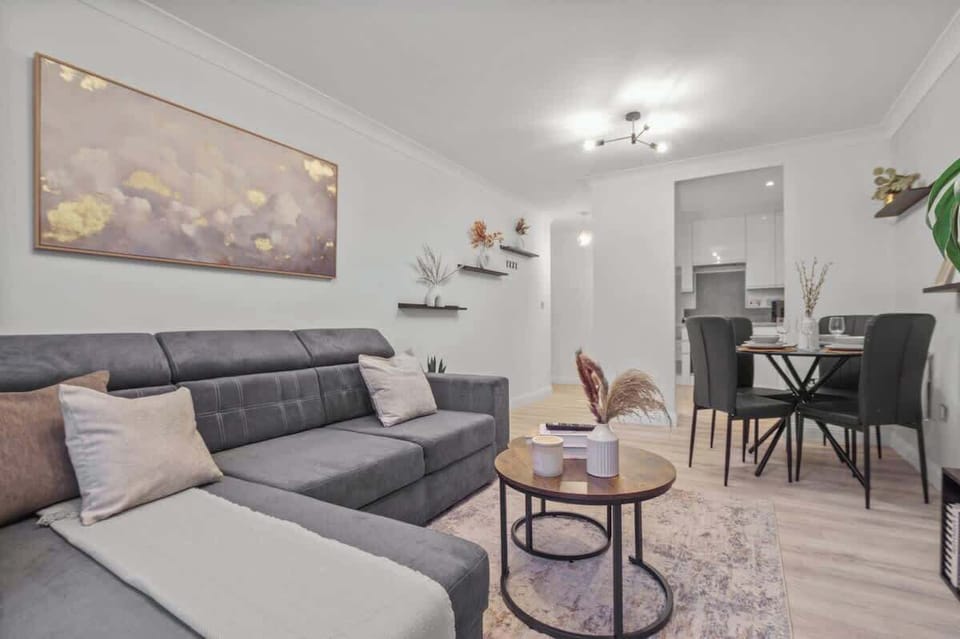 Living Room: Bright and airy space perfect for movie nights or intimate dinners with friends!