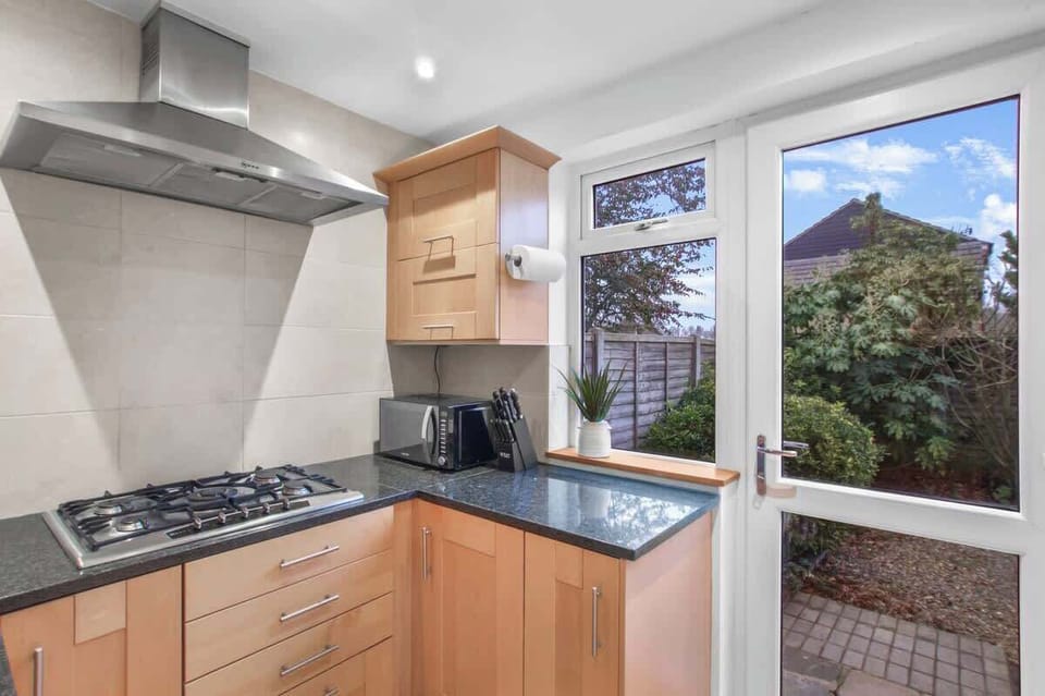 Gourmet Kitchen: Cook up a feast in this sunlit space with sleek finishes and modern appliances!