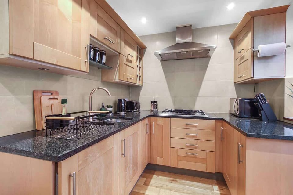 Gourmet Kitchen: Cook up a feast in this sunlit space with sleek finishes and modern appliances!