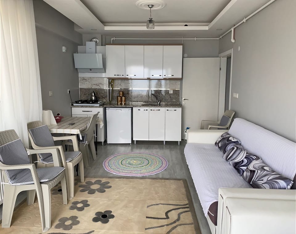 Standard Apartment, Multiple Beds, Balcony, Sea View | Private kitchen | Mini-fridge, stovetop, cookware/dishes/utensils