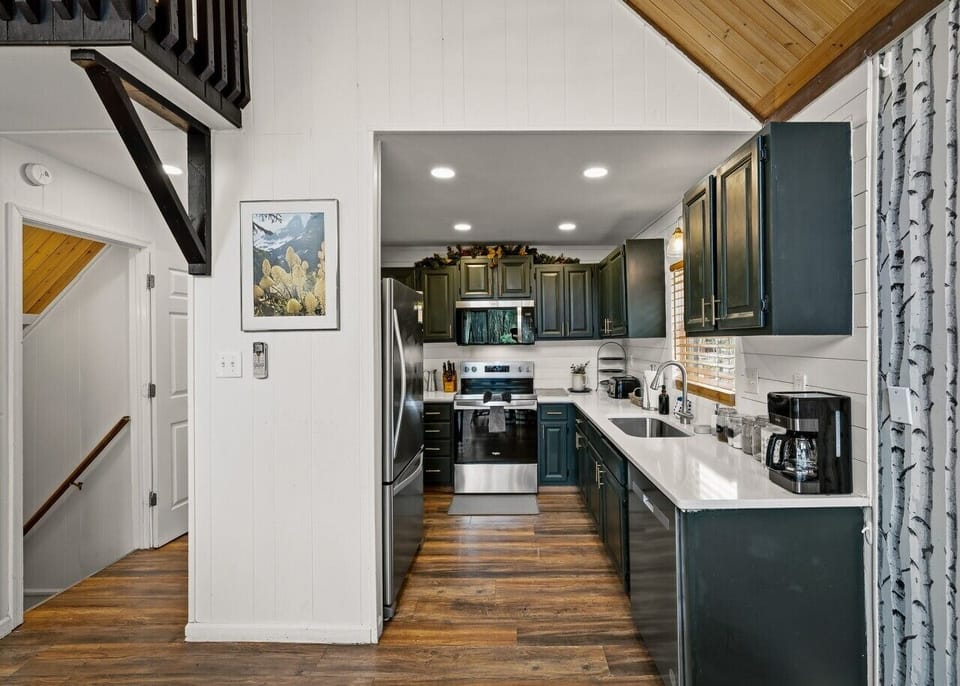 Kitchen | Stainless Steel Appliances | Dark Cabinets & Recessed Lighting