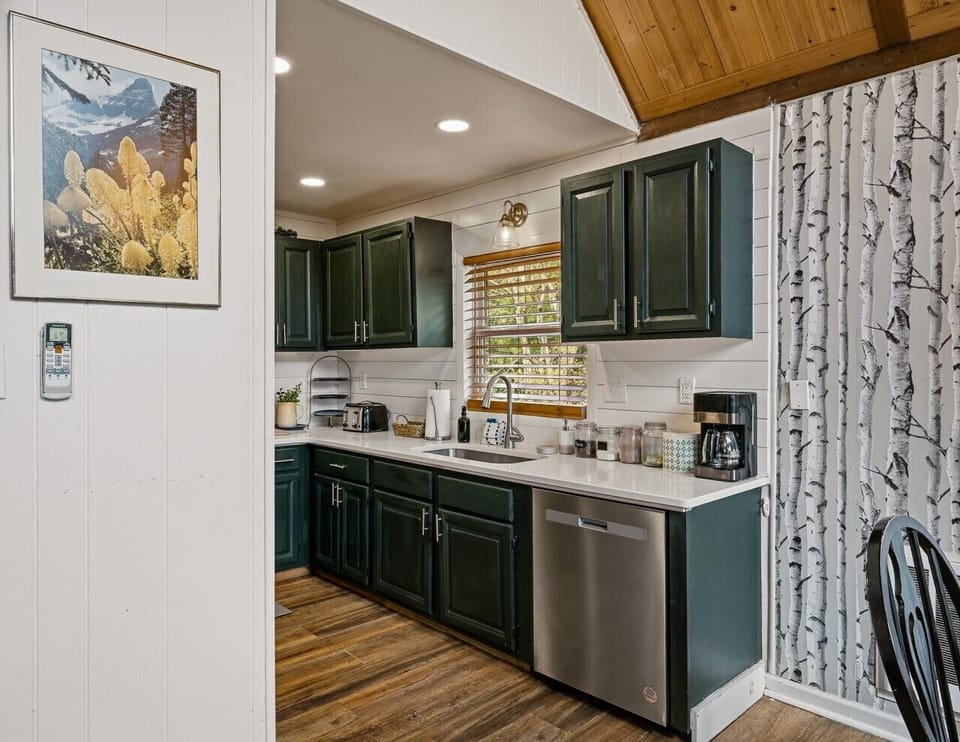 Kitchen | Stainless Steel Dishwasher | White Countertops & Coffee Station